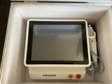 a white box with a monitor inside of it