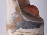 a clay sculpture of a man ' s head on top of a vase