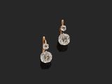 a pair of diamond earrings