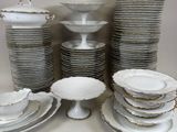 a lot of plates and bowls on the table