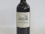 a bottle of wine that is sitting on a table