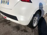 a white car that is parked in a parking lot