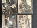 four old black and white photographs of people in a city