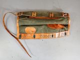 an image of a bag with a leather handle on a table