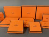 a group of orange boxes sitting on top of a table