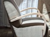 a chair that is sitting in front of a window