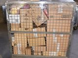 a large metal cart with boxes on it in a warehouse