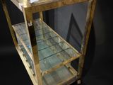 a glass display case with a glass shelf on top of it