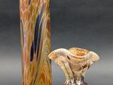 two vases sitting next to each other on a table