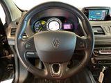 the interior of a car with a steering wheel and dashboard controls