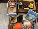 a box full of books and a clock on the floor