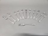 a lot of forks and spoons arranged in a circle