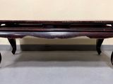 an image of a coffee table with a bench underneath it