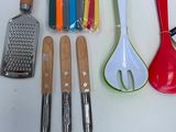 a lot of kitchen utensils that are on the counter