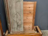 a wooden bed with a wooden frame on the floor