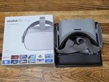 a box of oculus goggles sitting on a wooden table