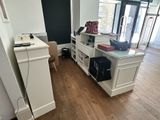 a room with a desk, a chair, and a laptop on it
