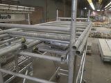 a large amount of scaffolding in a warehouse