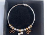 a close up of a bracelet in a box on a table