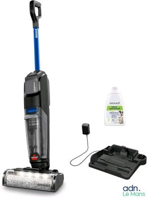 a black and blue vacuum cleaner with cleaning supplies on a white background