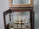a glass display case with a mirror on top of it