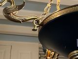 a chandelier hanging from the ceiling in a room