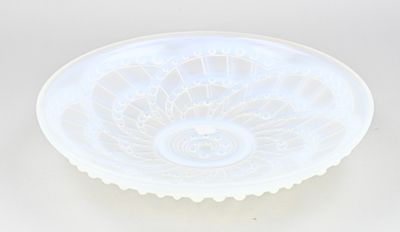 a white glass bowl with a flower design on it