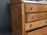a wooden dresser with a mirror on top of it