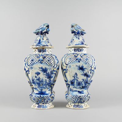 two blue and white vases with birds on them