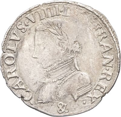 une pièce d'argent portant l'image d'un homme