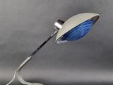 a white and blue lamp that is on a table