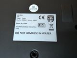 a close up of a printer with a do not immerse in water label on it