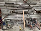 a pile of pipes and wires in a garage