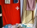 several towels hanging on a clothes line in a room