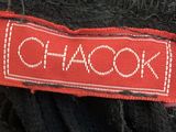 a close up of a label on the back of a black dress