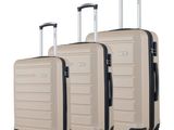 three pieces of luggage sitting on top of each other on wheels
