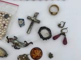 a lot of jewelry that is laying out on the table