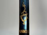 a close up of a blue book with gold writing on it