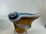 a glass vase that has a blue and white design on it