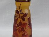 a small vase with a floral design on it