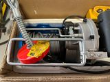 a box that has some tools in it on a table