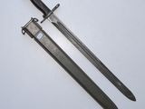 an old pair of two black swords on a white surface