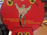 a red sign with a picture of a cartoon character on it