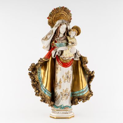 a statue of a woman holding a baby in her arms