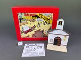 an image of a box with a small building and dice game