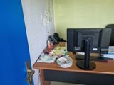 a desk with a computer and a monitor on it