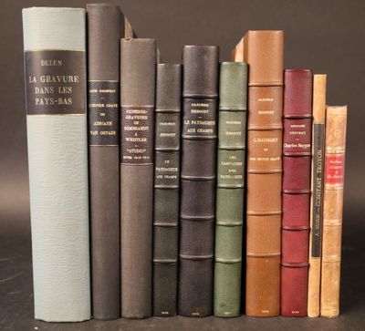 several old books are lined up on a shelf in front of a black background