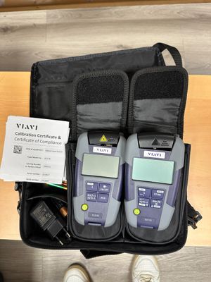 two electronic devices in a bag on a table