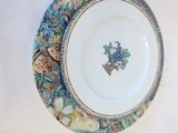 a plate and a bowl on a white table cloth
