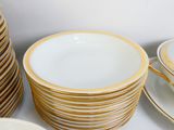 a lot of plates and cups on the table
